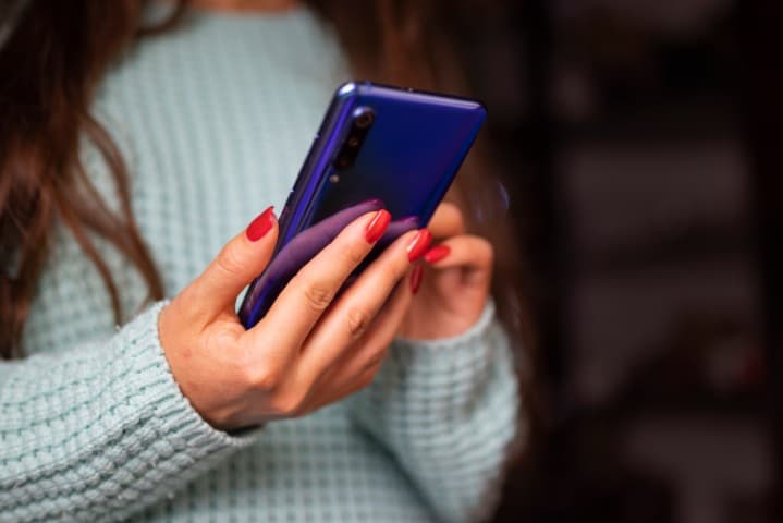 Girl holding a phone.